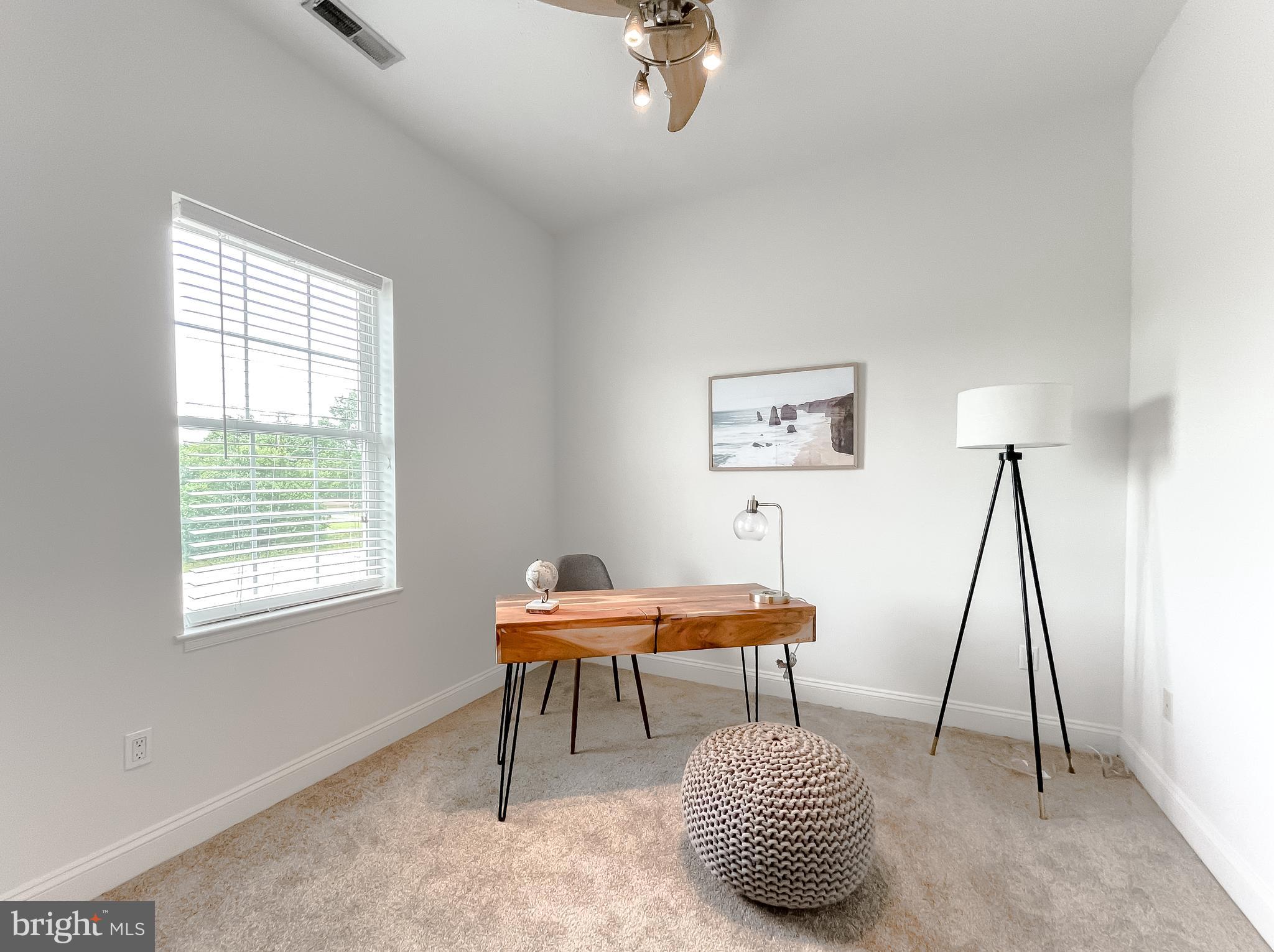 48673 Trapp Road St. Inigoes, MD 20684 - Photo 17 of 39 a bedroom with furniture and a window