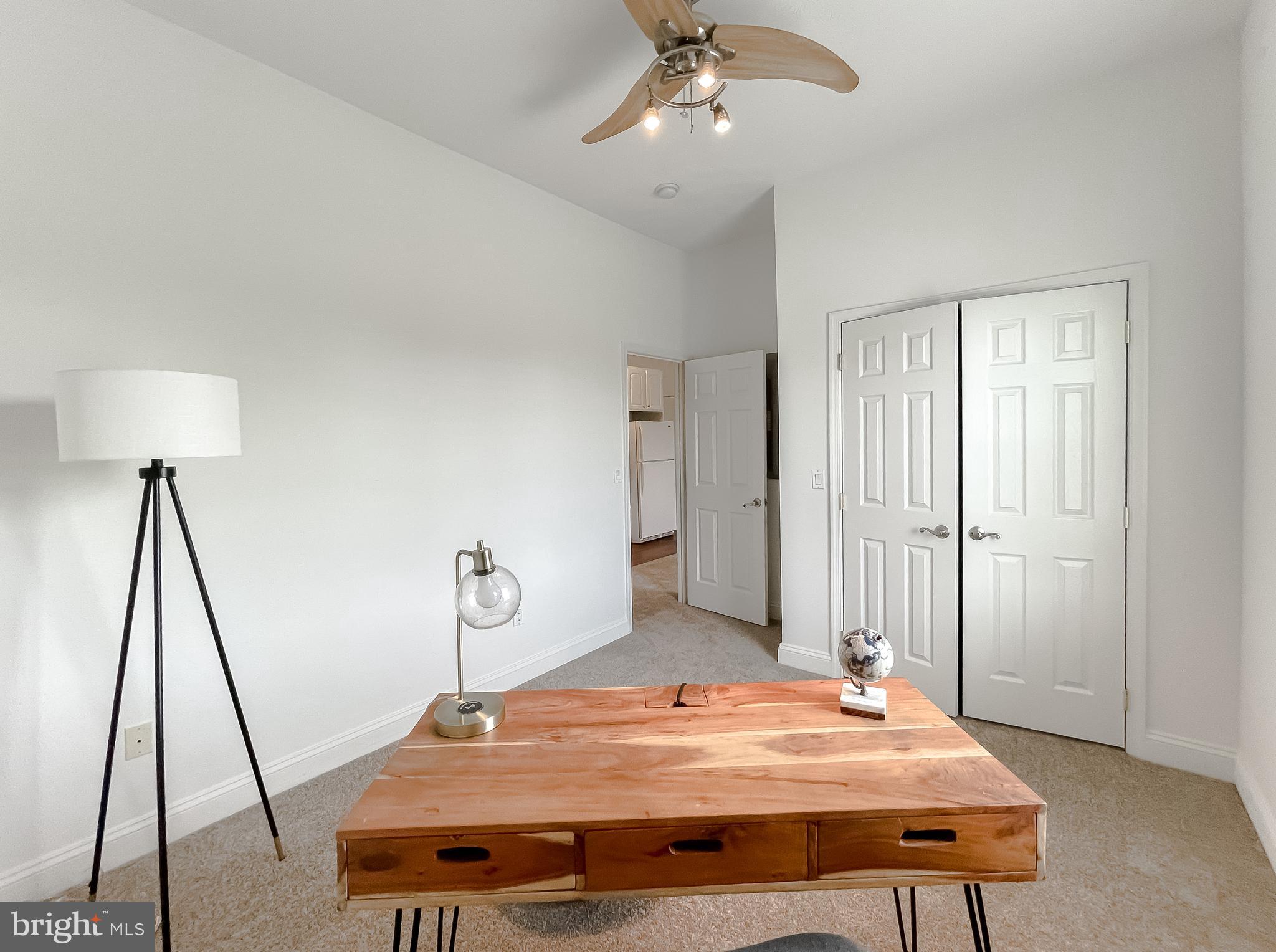 48673 Trapp Road St. Inigoes, MD 20684 - Photo 19 of 39 a room with a table chairs and wooden floor