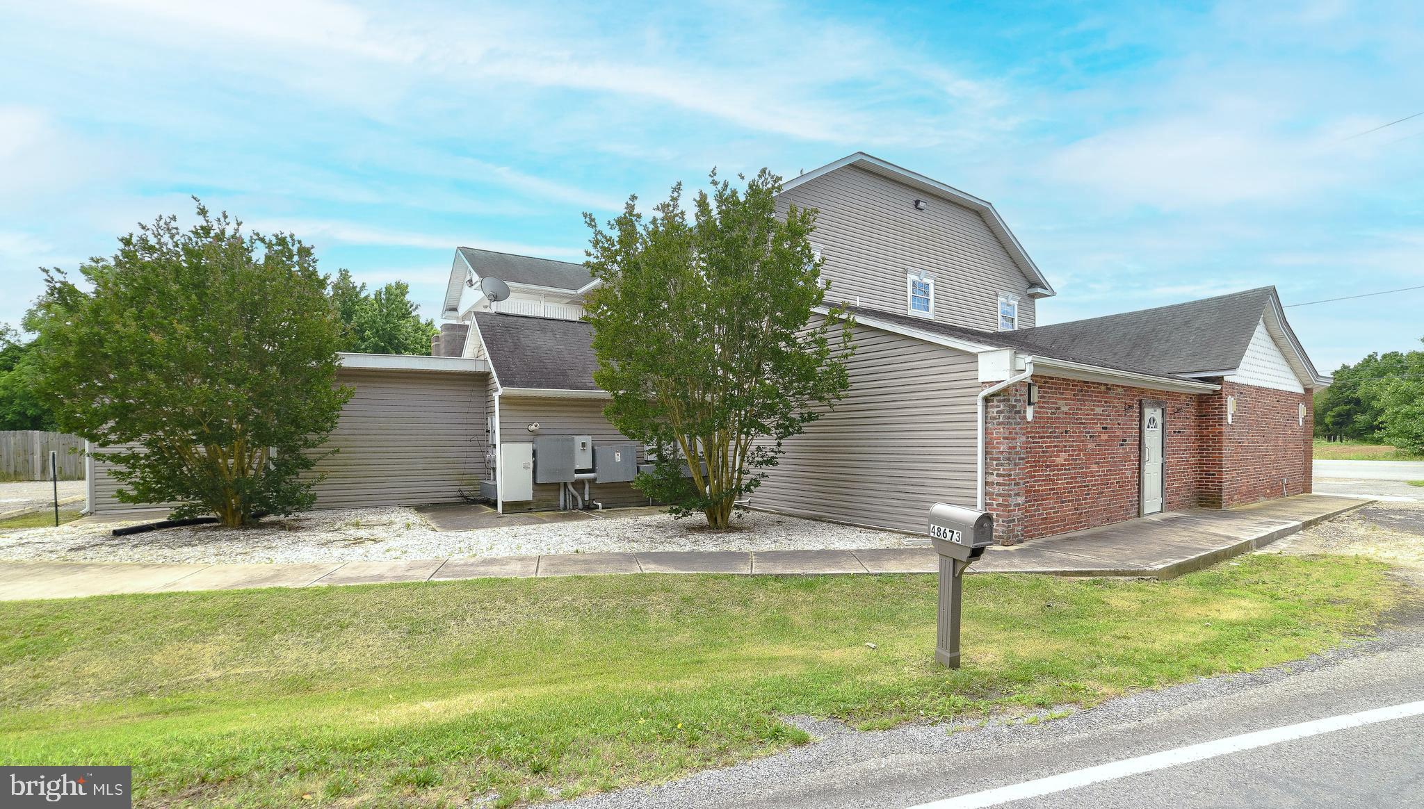 48673 Trapp Road St. Inigoes, MD 20684 - Photo 2 of 39 a house view with swimming pool in front of it