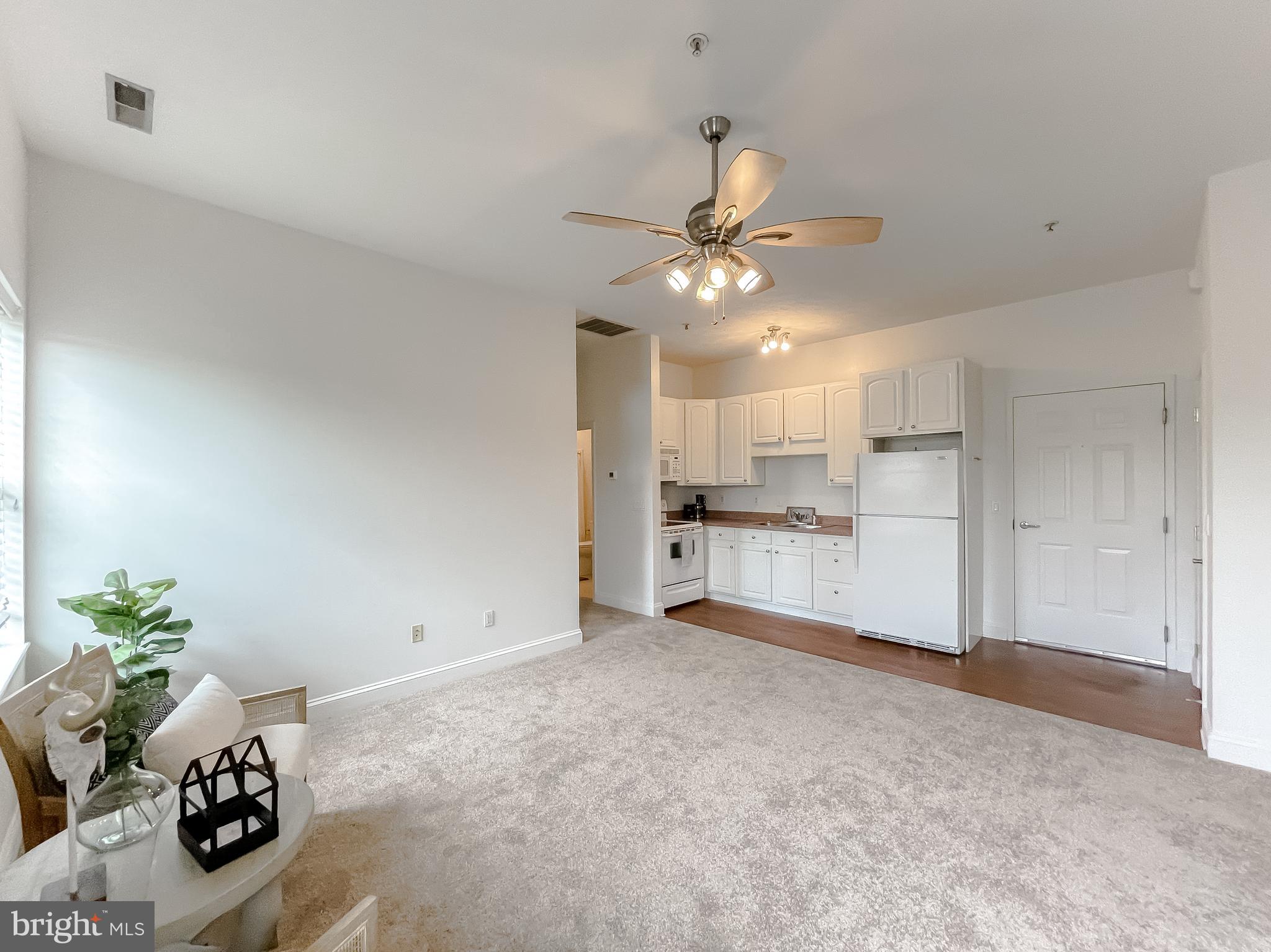 48673 Trapp Road St. Inigoes, MD 20684 - Photo 8 of 39 a view of a kitchen with a sink cabinets and potted plant