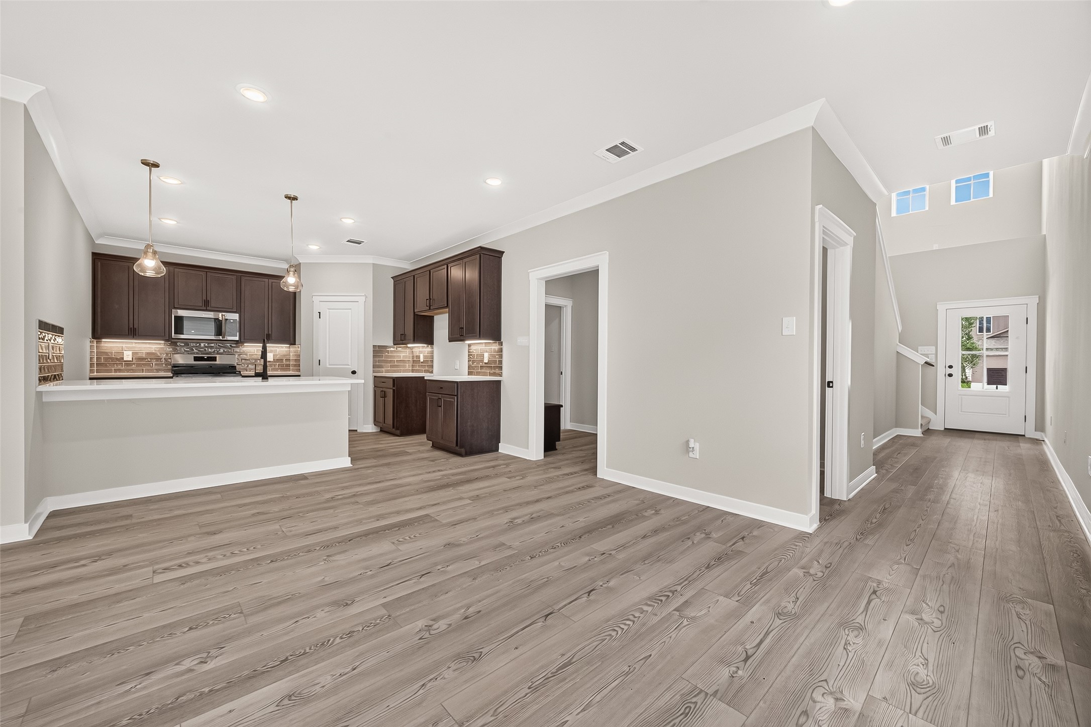 21122 Autumn Heights Rosharon, TX 77583 - Photo 8 of 42 a view of a kitchen with a sink and a refrigerator