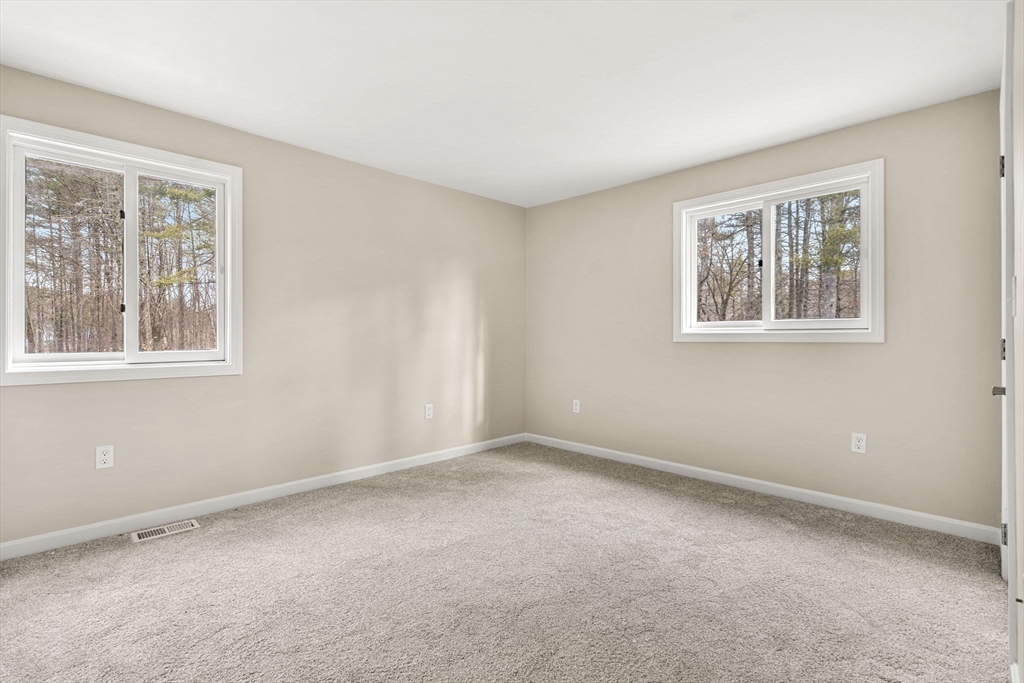 153 Coffin Road, Unit 10 Epping, NH 03042 - Photo 14 of 31 a view of an empty room with a window