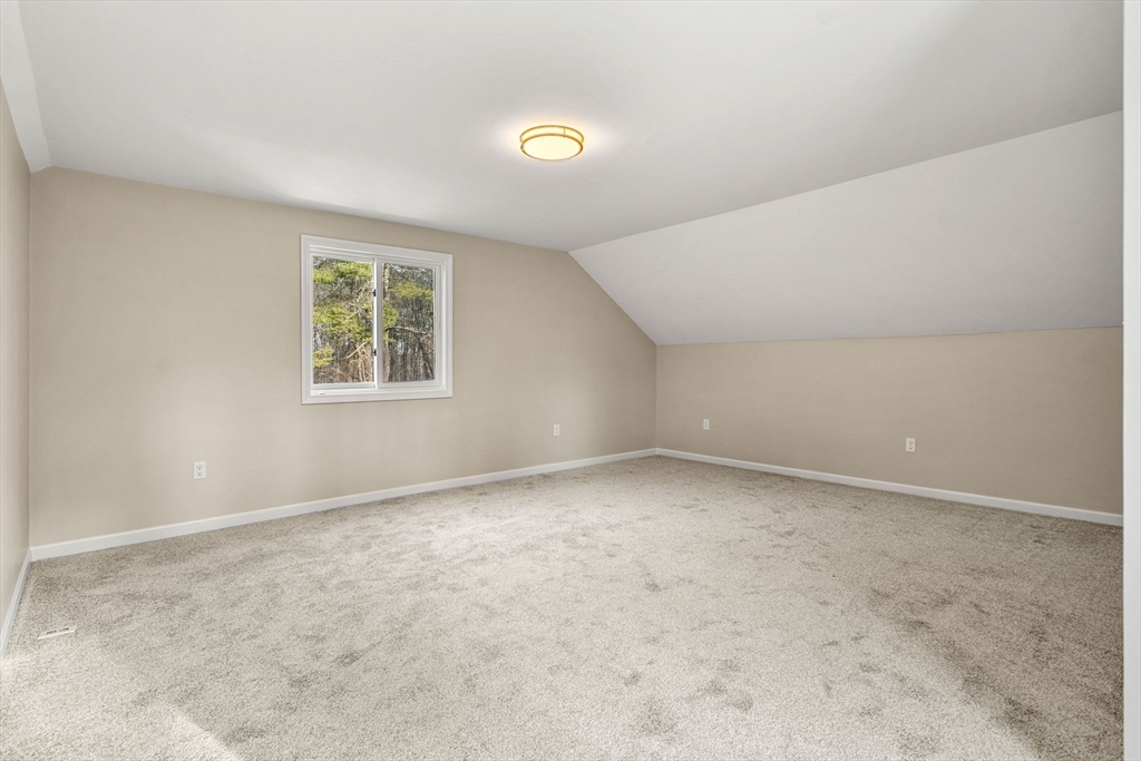 153 Coffin Road, Unit 10 Epping, NH 03042 - Photo 29 of 31 an empty room with windows and window