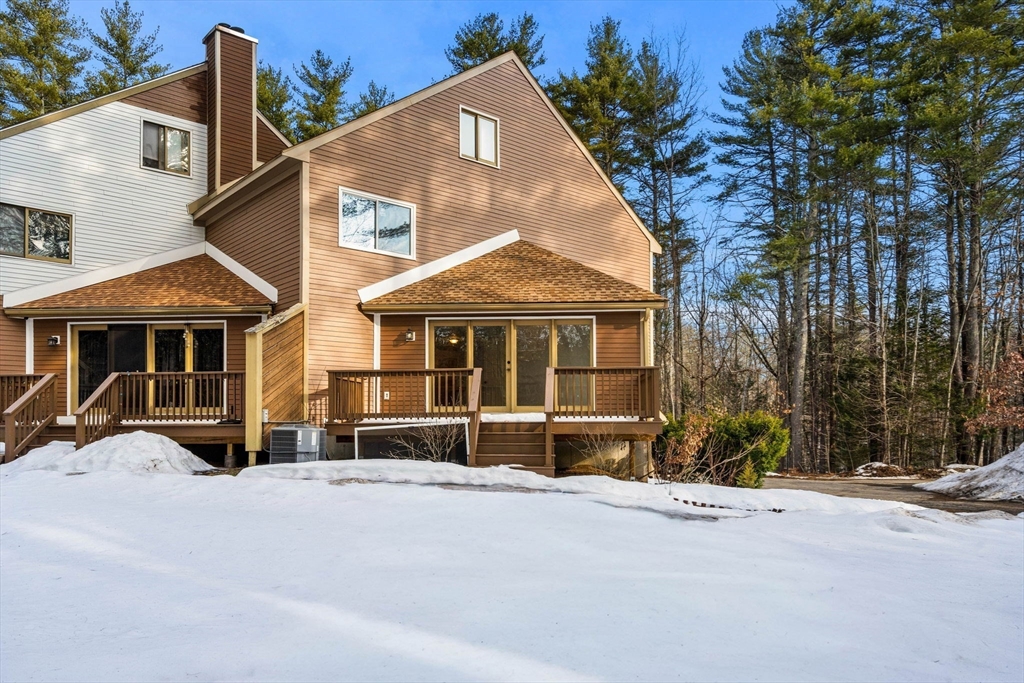 153 Coffin Road, Unit 10 Epping, NH 03042 - Photo 5 of 31 a front view of a house with a yard