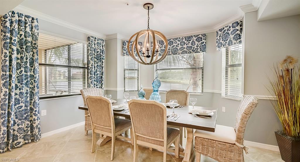9584 Trevi Court, Unit 5227 Naples, FL 34113 - Photo 11 of 26 a view of a dining room with furniture window and outside view