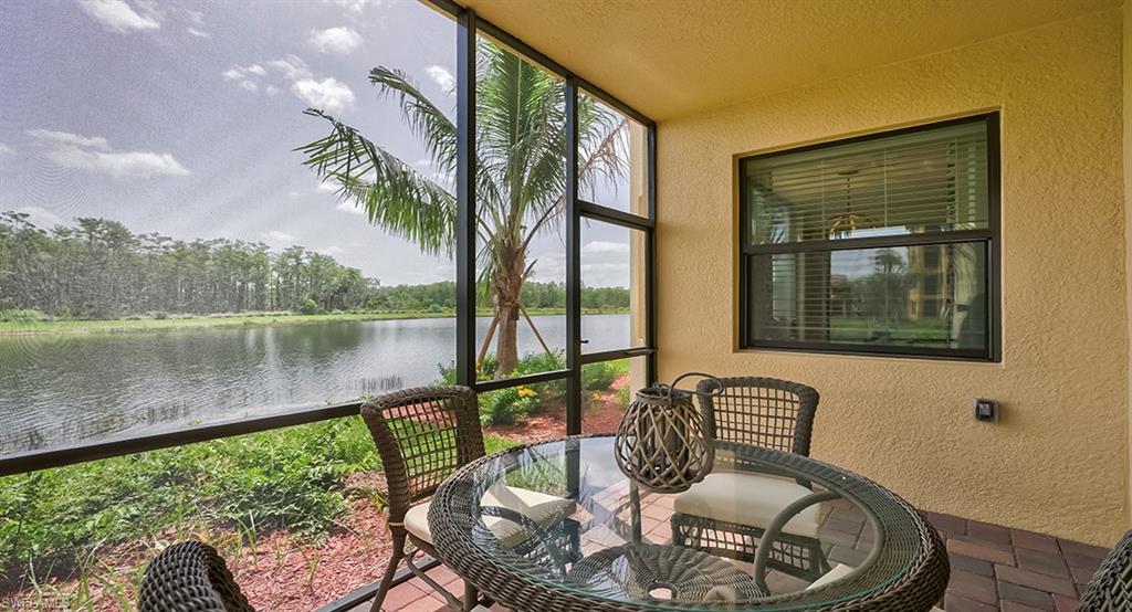 9584 Trevi Court, Unit 5227 Naples, FL 34113 - Photo 17 of 26 a balcony with table and chairs