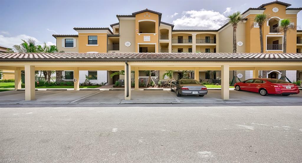 9584 Trevi Court, Unit 5227 Naples, FL 34113 - Photo 19 of 26 front view of a building with a street