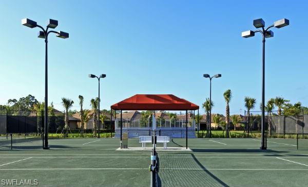 9584 Trevi Court, Unit 5227 Naples, FL 34113 - Photo 26 of 26 a view of a park with a large tree