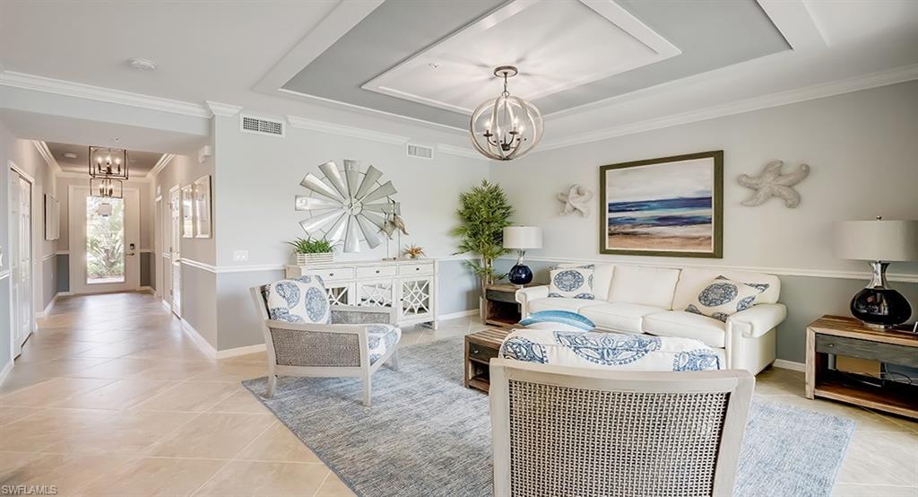 9584 Trevi Court, Unit 5227 Naples, FL 34113 - Photo 5 of 26 a living room with furniture