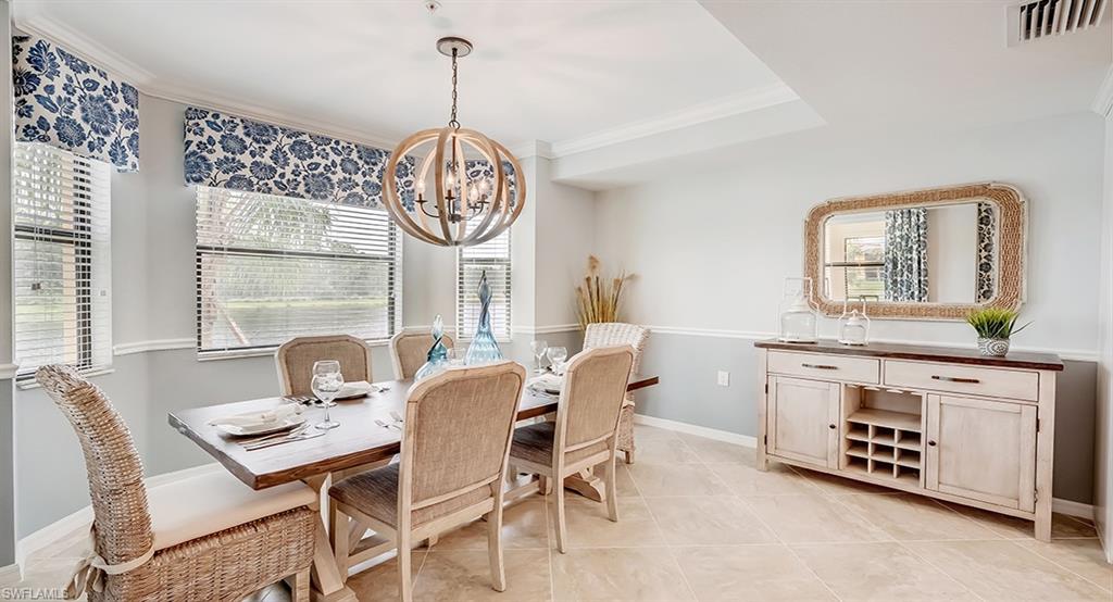9584 Trevi Court, Unit 5227 Naples, FL 34113 - Photo 10 of 26 a view of a dining room with furniture window and outside view