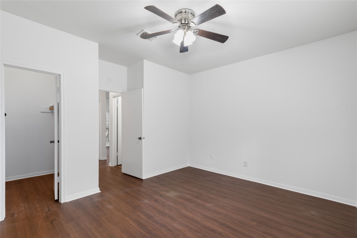 3500 Tangle Brush Drive, Unit 193 Spring, TX 77381 - Photo 19 of 26 This room is bright, with fresh white walls and rich wood flooring. It features a ceiling fan with lights, and has doors leading to a closet and other areas of the home.