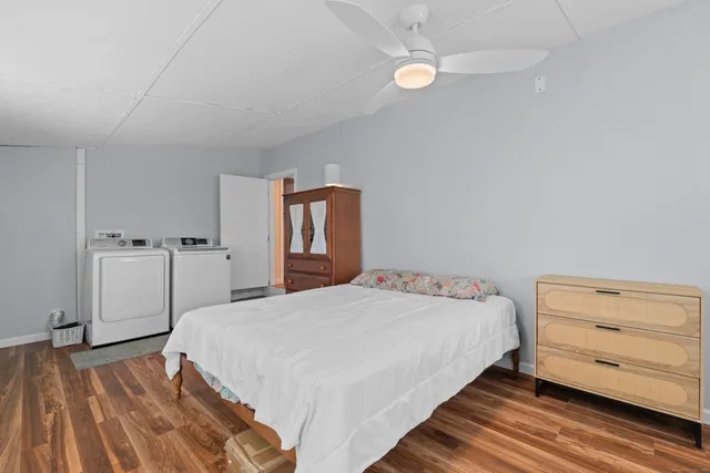 a bedroom with a bed and a dresser