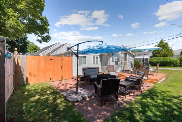a patio with tables and chairs