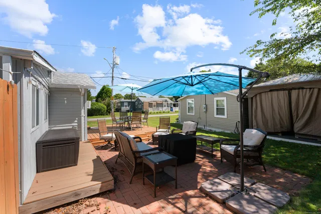 a patio with patio table and chairs