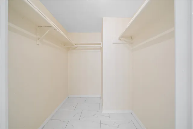a view of an empty walk in closet