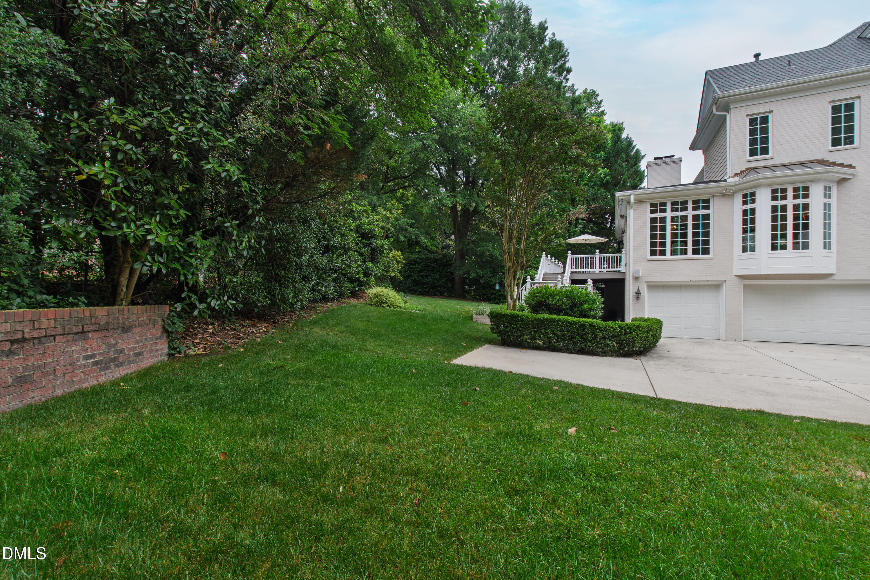 2536 Wake Drive Raleigh, NC 27608 - Photo 68 of 74 a view of a house with a yard and sitting area