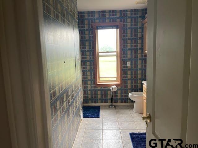 109 Cherry Blossom Road Ore City, TX 75683 - Photo 14 of 32 a bathroom with a sink and a toilet