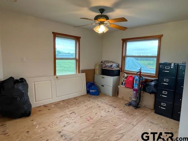 109 Cherry Blossom Road Ore City, TX 75683 - Photo 19 of 32 a bedroom with a bed and a window