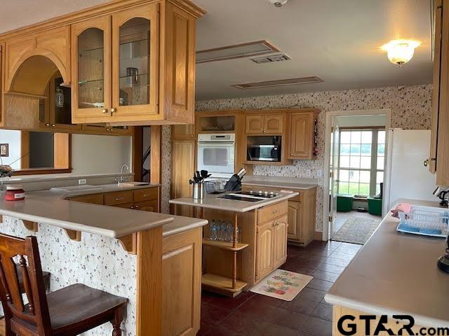 109 Cherry Blossom Road Ore City, TX 75683 - Photo 3 of 32 a kitchen with stainless steel appliances granite countertop a stove and a refrigerator