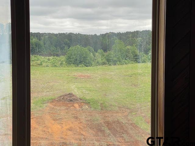 109 Cherry Blossom Road Ore City, TX 75683 - Photo 32 of 32 a view of a lake from a window