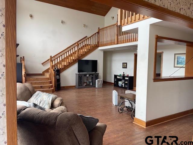 109 Cherry Blossom Road Ore City, TX 75683 - Photo 7 of 32 a living room with furniture and a dining table with wooden floor