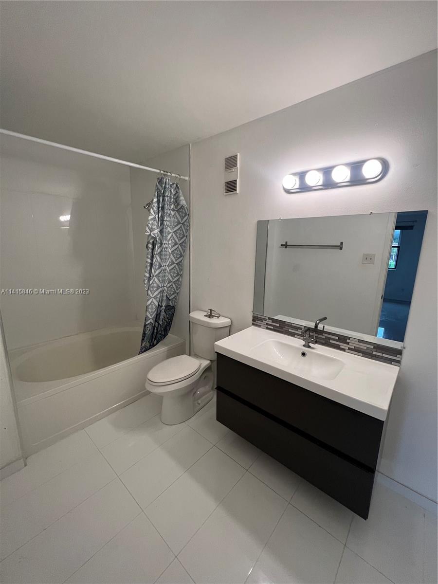 The Hammocks Miami, FL 33196 - Photo 16 of 20 a bathroom with a sink a toilet and shower