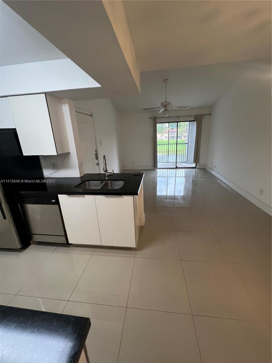 The Hammocks Miami, FL 33196 - Photo 10 of 20 a kitchen with a sink a window and cabinets