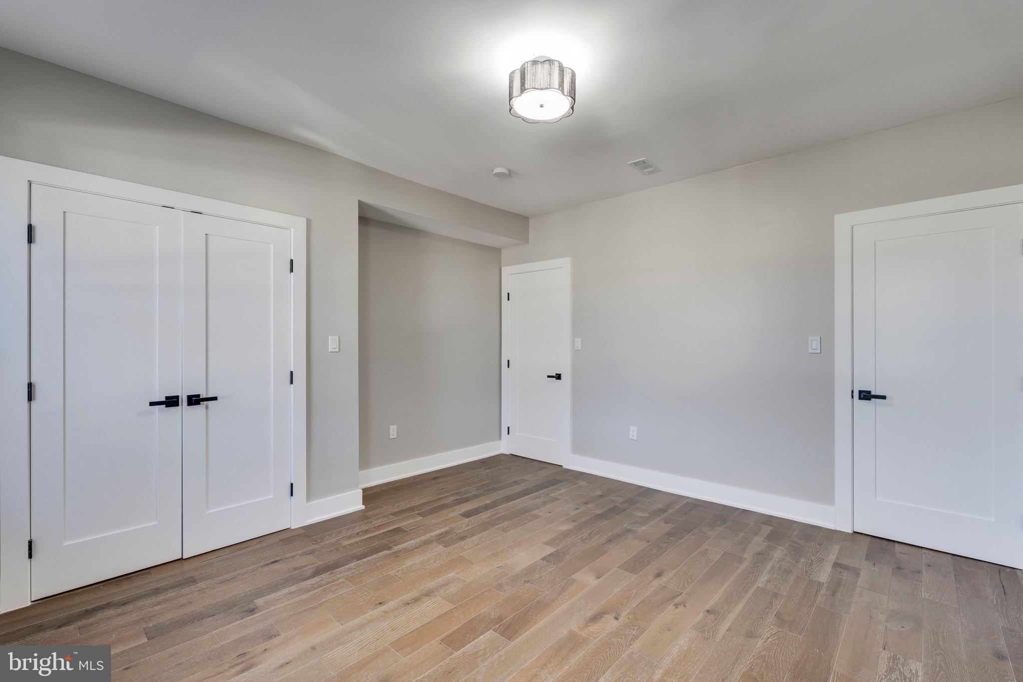 1703 West Virginia Avenue Northeast, Unit 2 Washington, DC 20002 - Photo 11 of 54 a view of an empty room with wooden floor