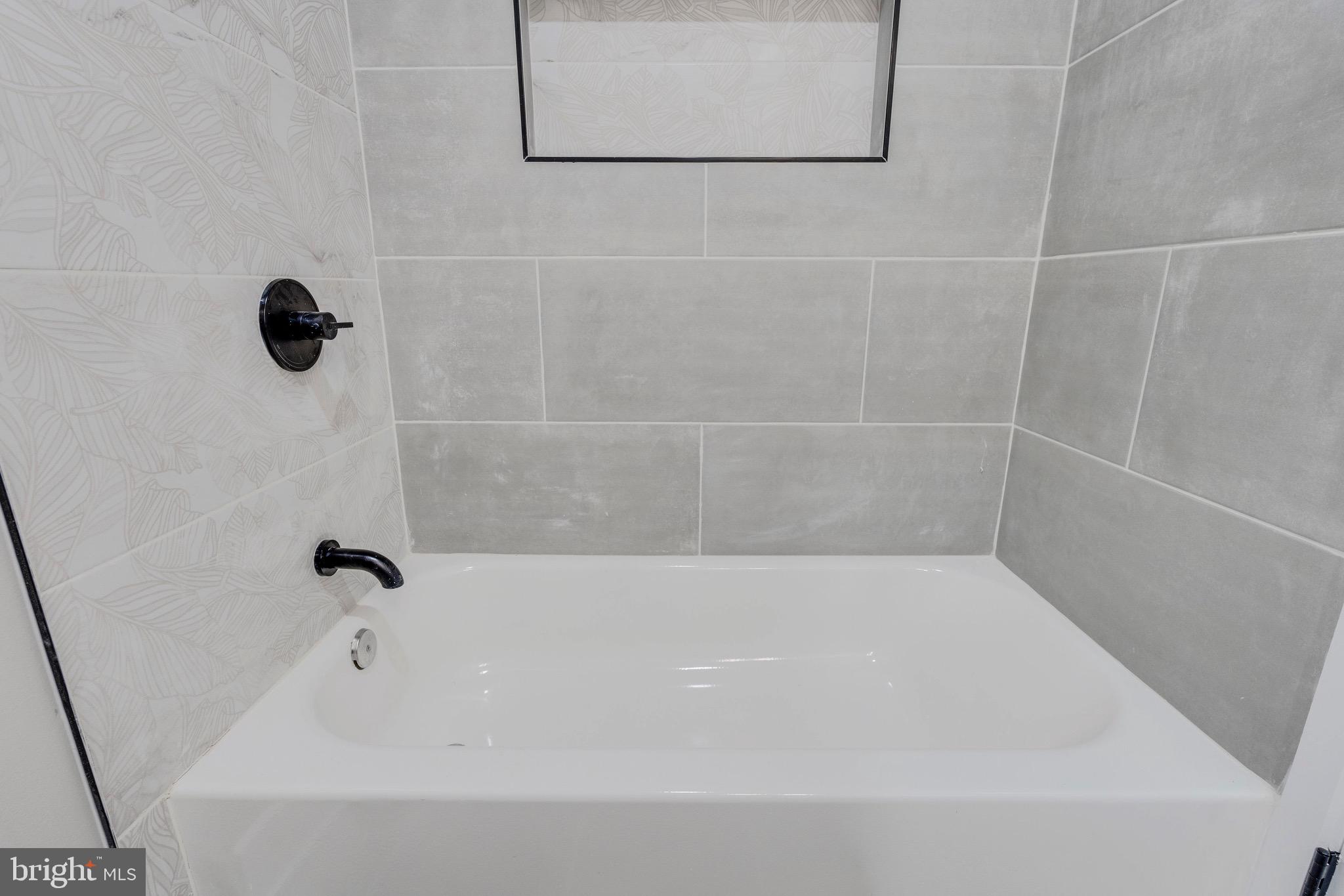 1703 West Virginia Avenue Northeast, Unit 2 Washington, DC 20002 - Photo 16 of 54 a bathroom with a bathtub