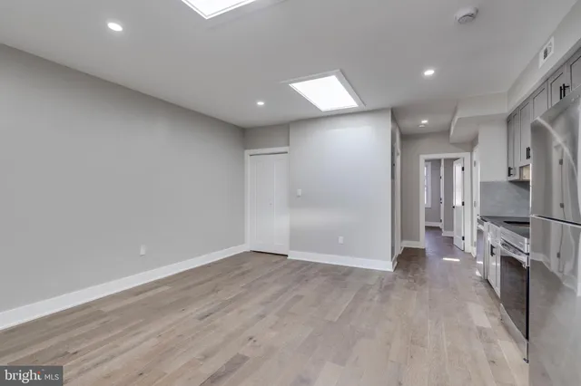 a view of a kitchen with a refrigerator and a stove