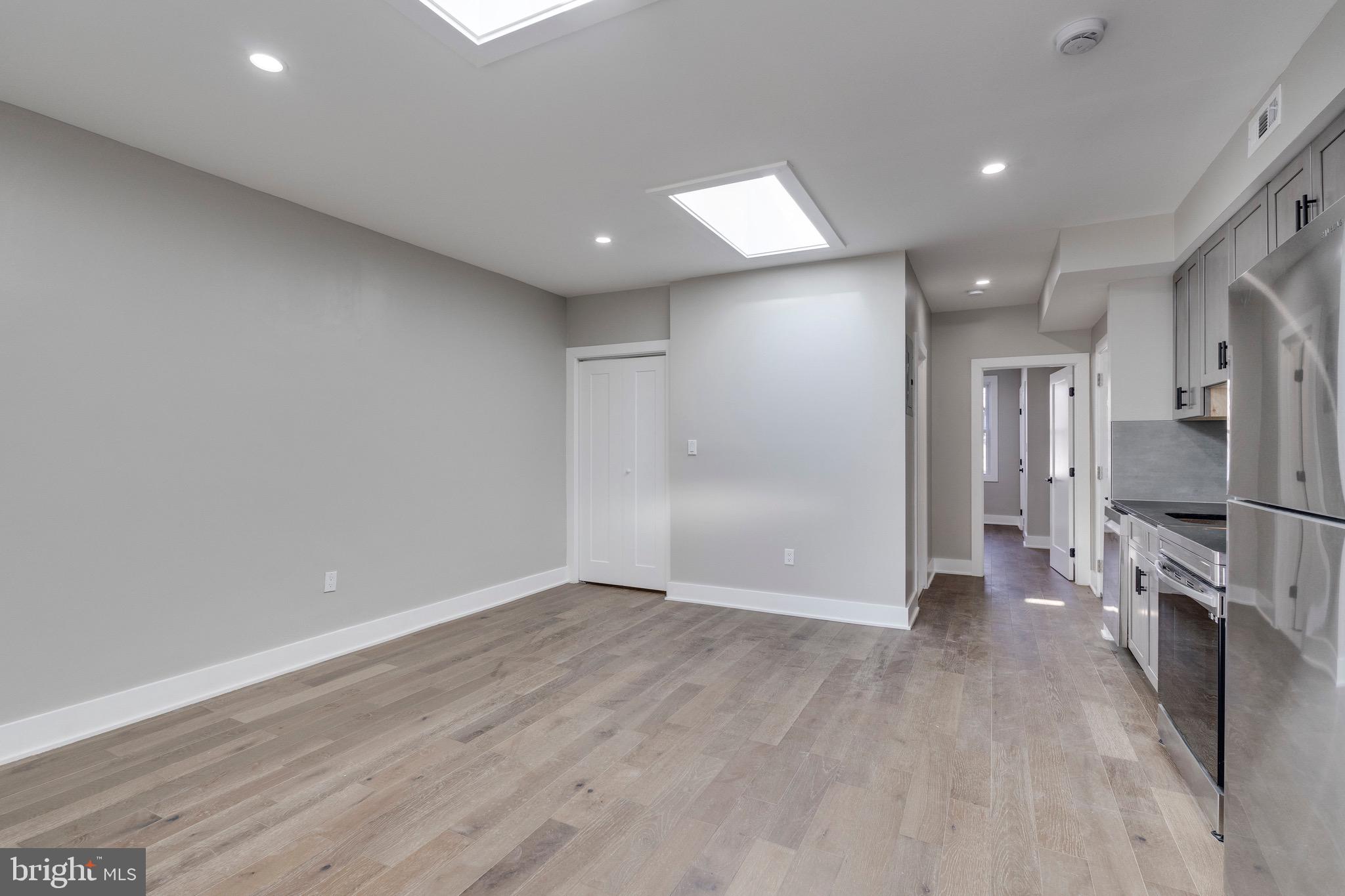 1703 West Virginia Avenue Northeast, Unit 2 Washington, DC 20002 - Photo 22 of 54 a view of a kitchen with a refrigerator and a stove