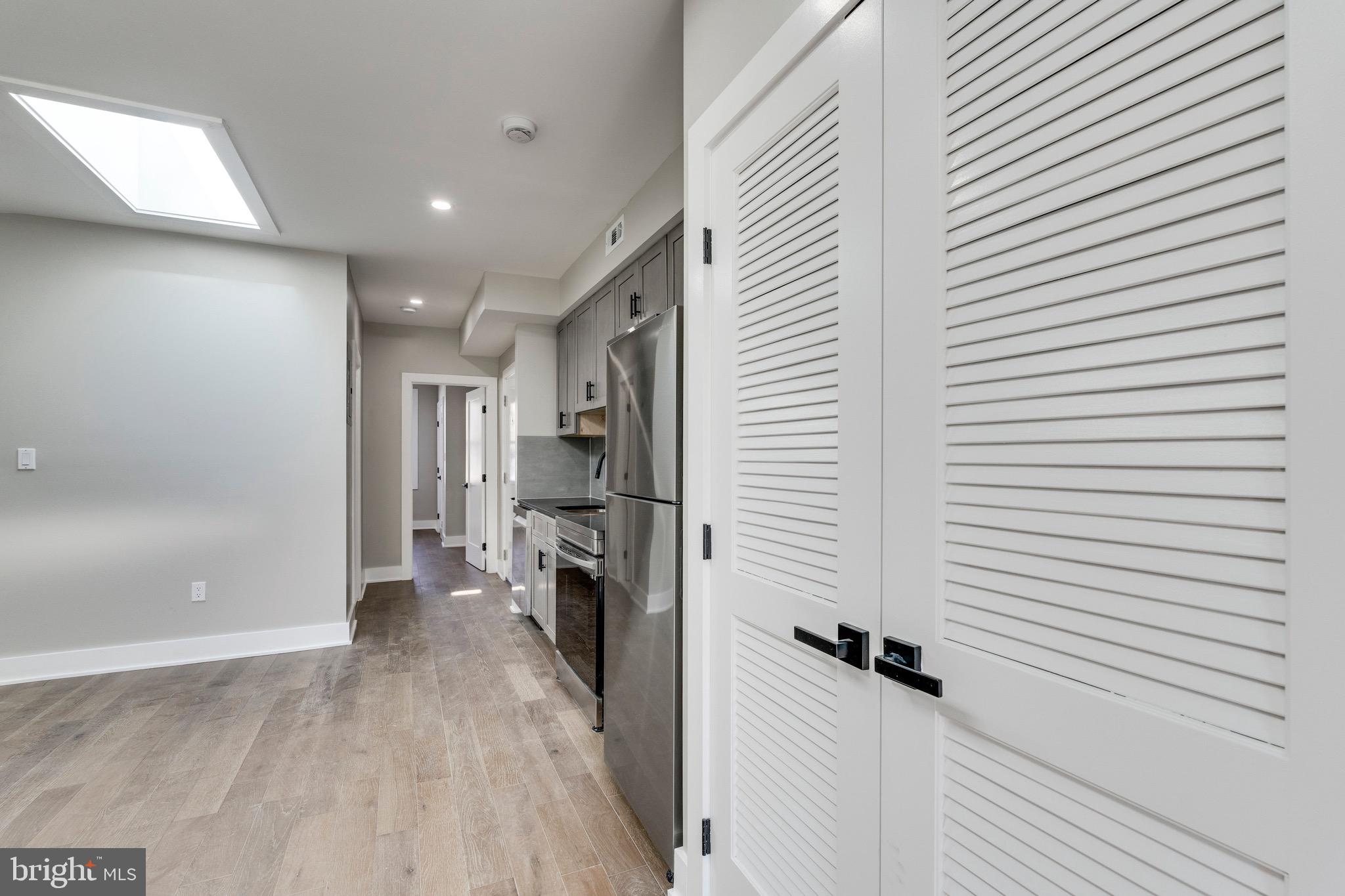 1703 West Virginia Avenue Northeast, Unit 2 Washington, DC 20002 - Photo 23 of 54 a view of a hallway with a kitchen