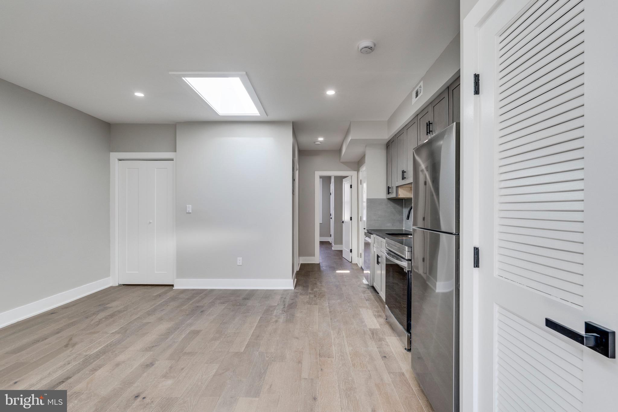 1703 West Virginia Avenue Northeast, Unit 2 Washington, DC 20002 - Photo 24 of 54 a view of a kitchen with a sink and refrigerator