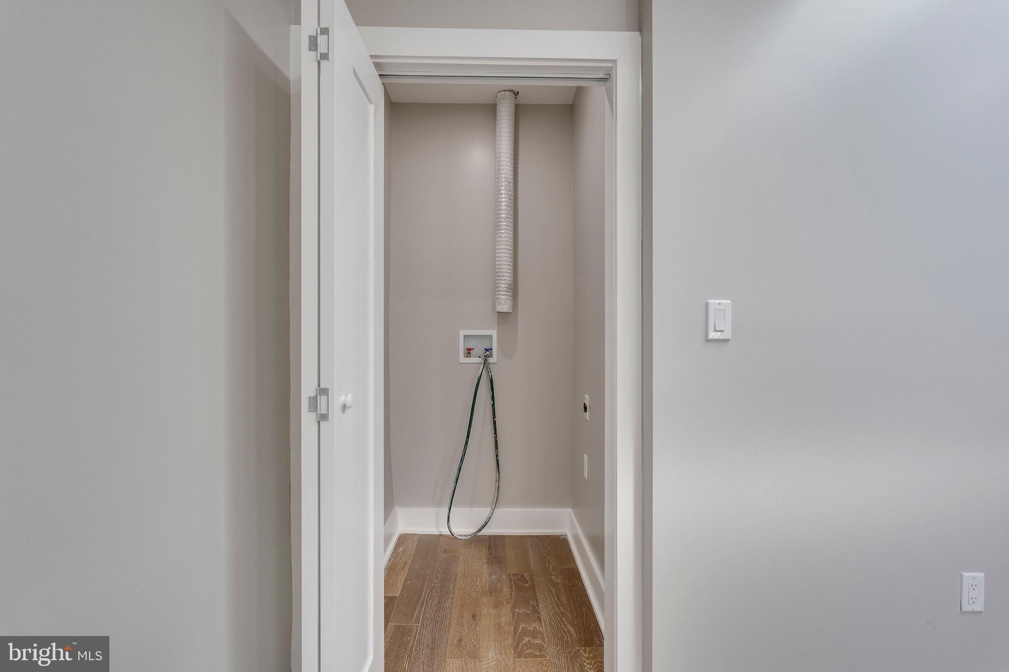 1703 West Virginia Avenue Northeast, Unit 2 Washington, DC 20002 - Photo 33 of 54 a view of a hallway with wooden floor