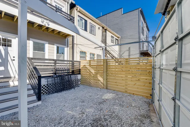 a view of entryway with wooden stairs