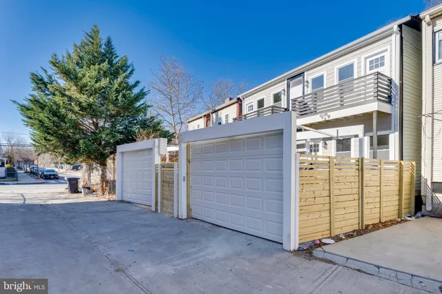 a view of a house with barbeque and wooden floor