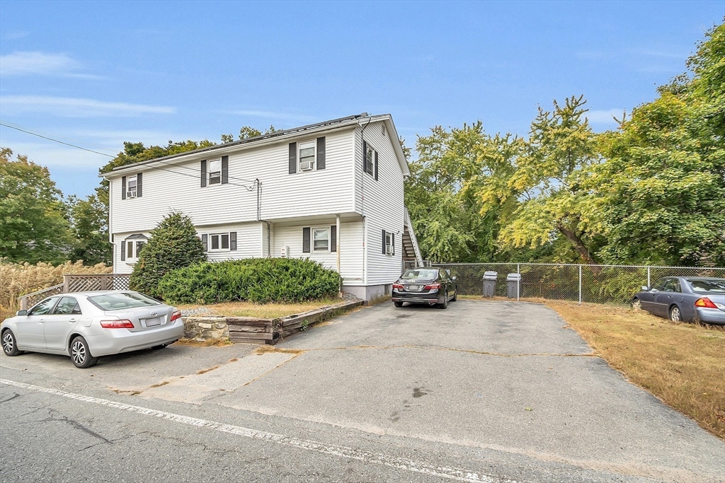 296 Howe Street Methuen, MA 01844 - Photo 2 of 12 a view of a car parked in front of a house