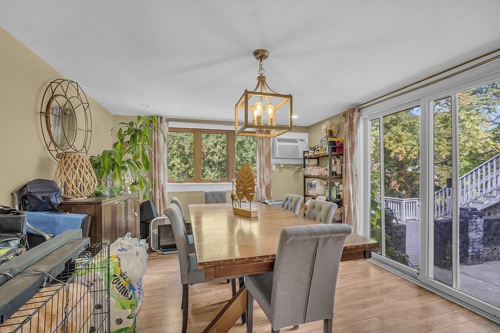 296 Howe Street Methuen, MA 01844 - Photo 5 of 12 a dining room with furniture a chandelier and wooden floor
