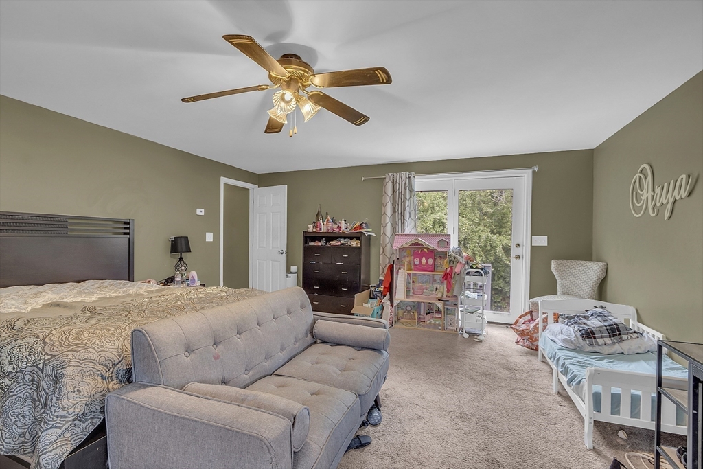 296 Howe Street Methuen, MA 01844 - Photo 9 of 12 a bedroom with furniture and a window