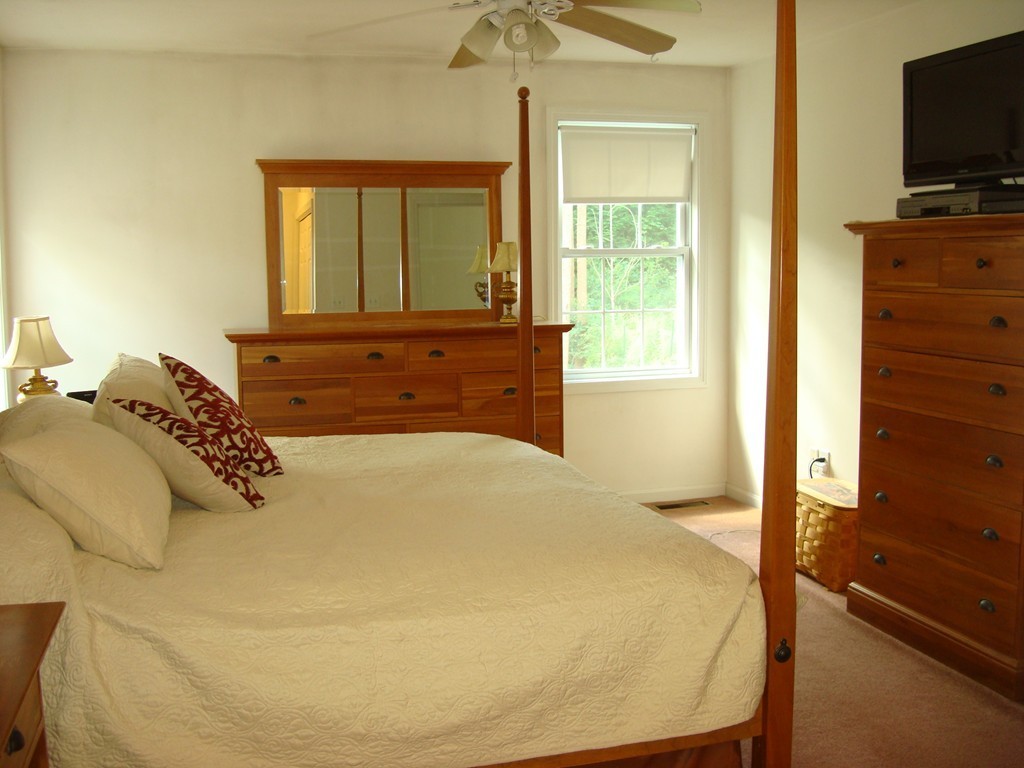 18 Rebecca Road Freetown, MA 02702 - Photo 19 of 30 a bedroom with a bed and a flat screen tv