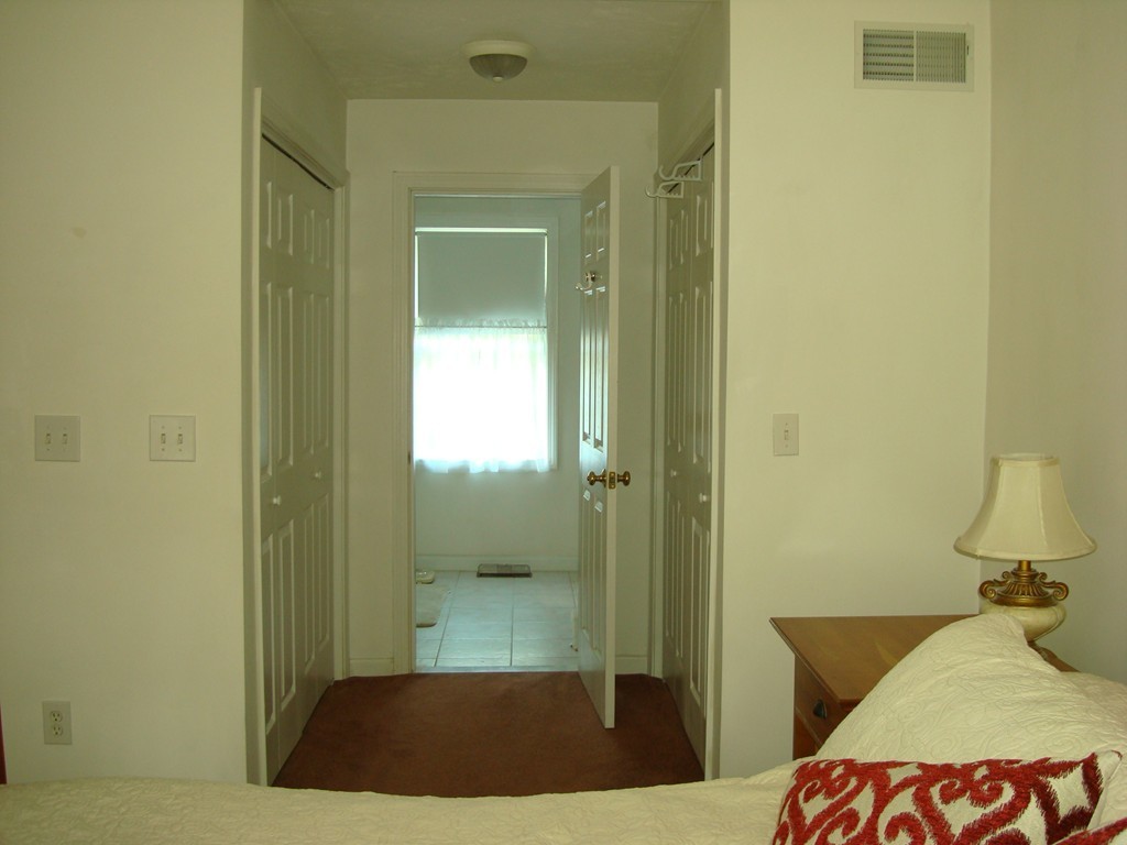 18 Rebecca Road Freetown, MA 02702 - Photo 21 of 30 a bedroom with a bed and a mirror