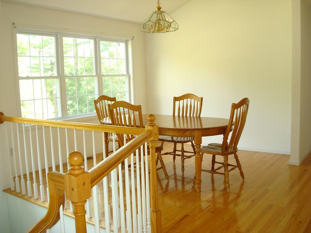 18 Rebecca Road Freetown, MA 02702 - Photo 4 of 30 a view of a dining room with furniture a chandelier and wooden floor