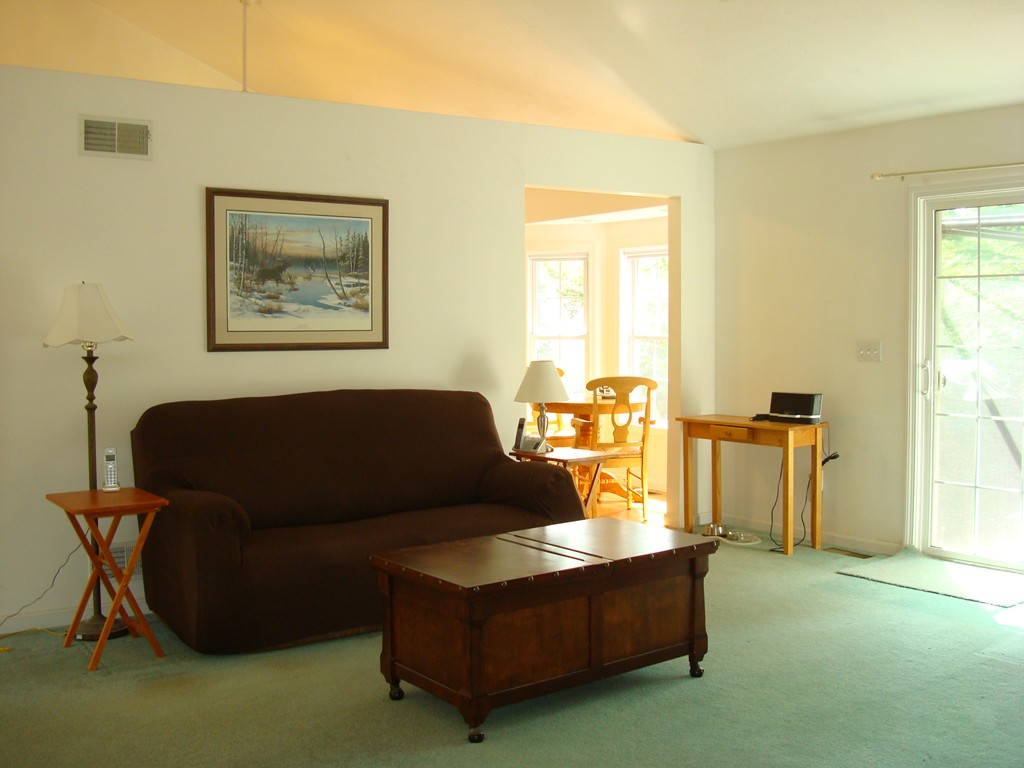 18 Rebecca Road Freetown, MA 02702 - Photo 7 of 30 a living room with furniture and a open kitchen