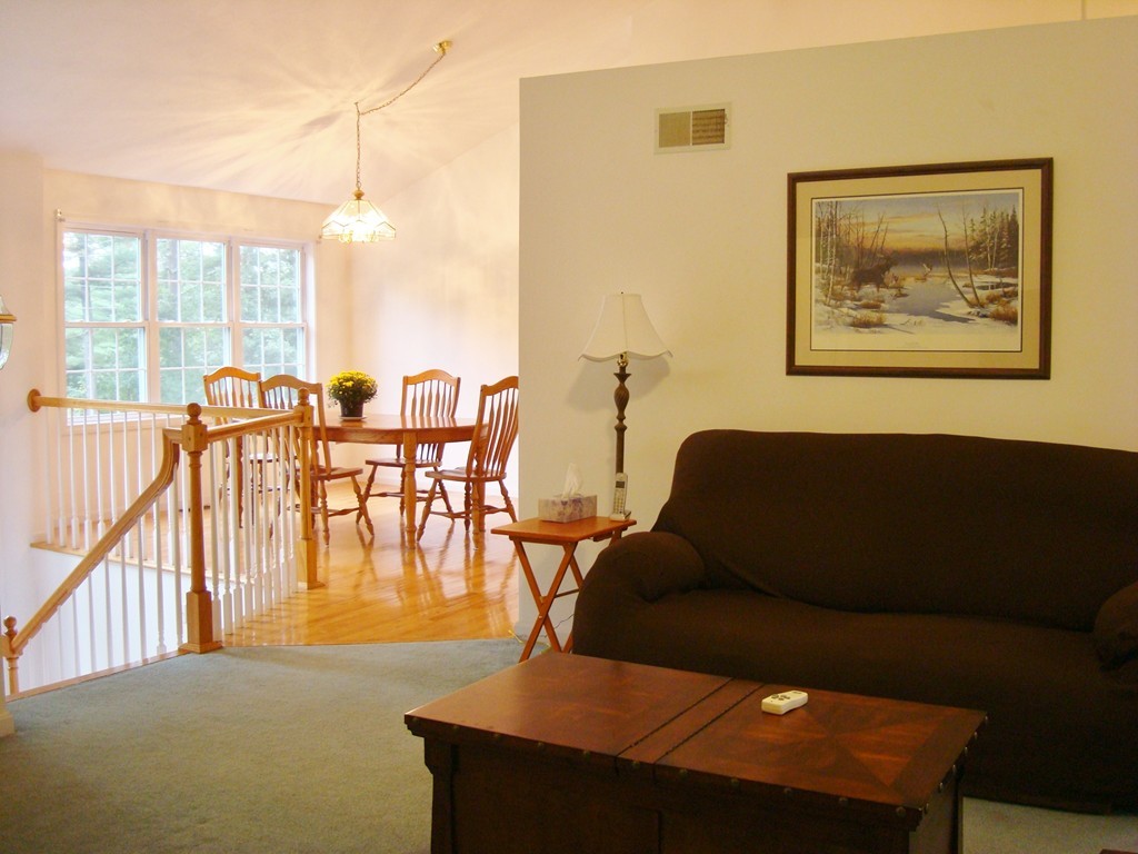 18 Rebecca Road Freetown, MA 02702 - Photo 8 of 30 a living room with furniture and floor to ceiling windows