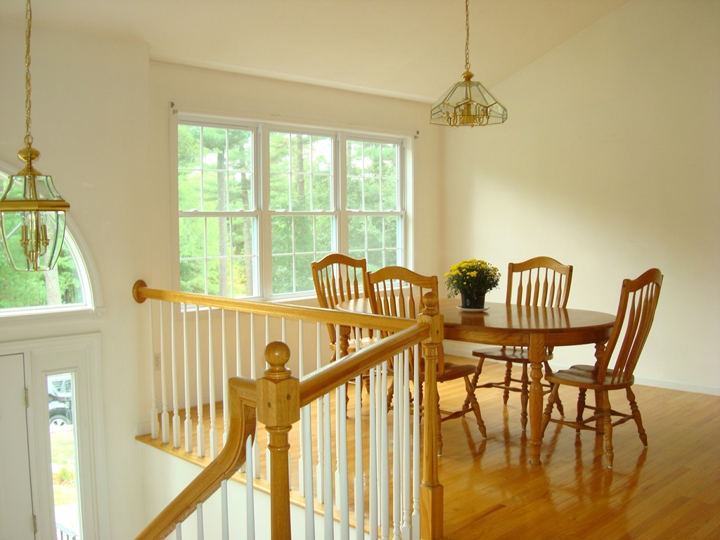 18 Rebecca Road Freetown, MA 02702 - Photo 9 of 30 a view of a dining room with furniture a chandelier and a large window
