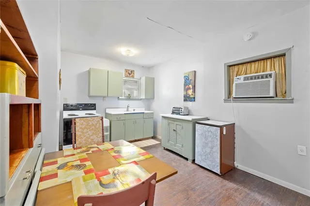 a kitchen with stainless steel appliances kitchen island granite countertop a sink and cabinets