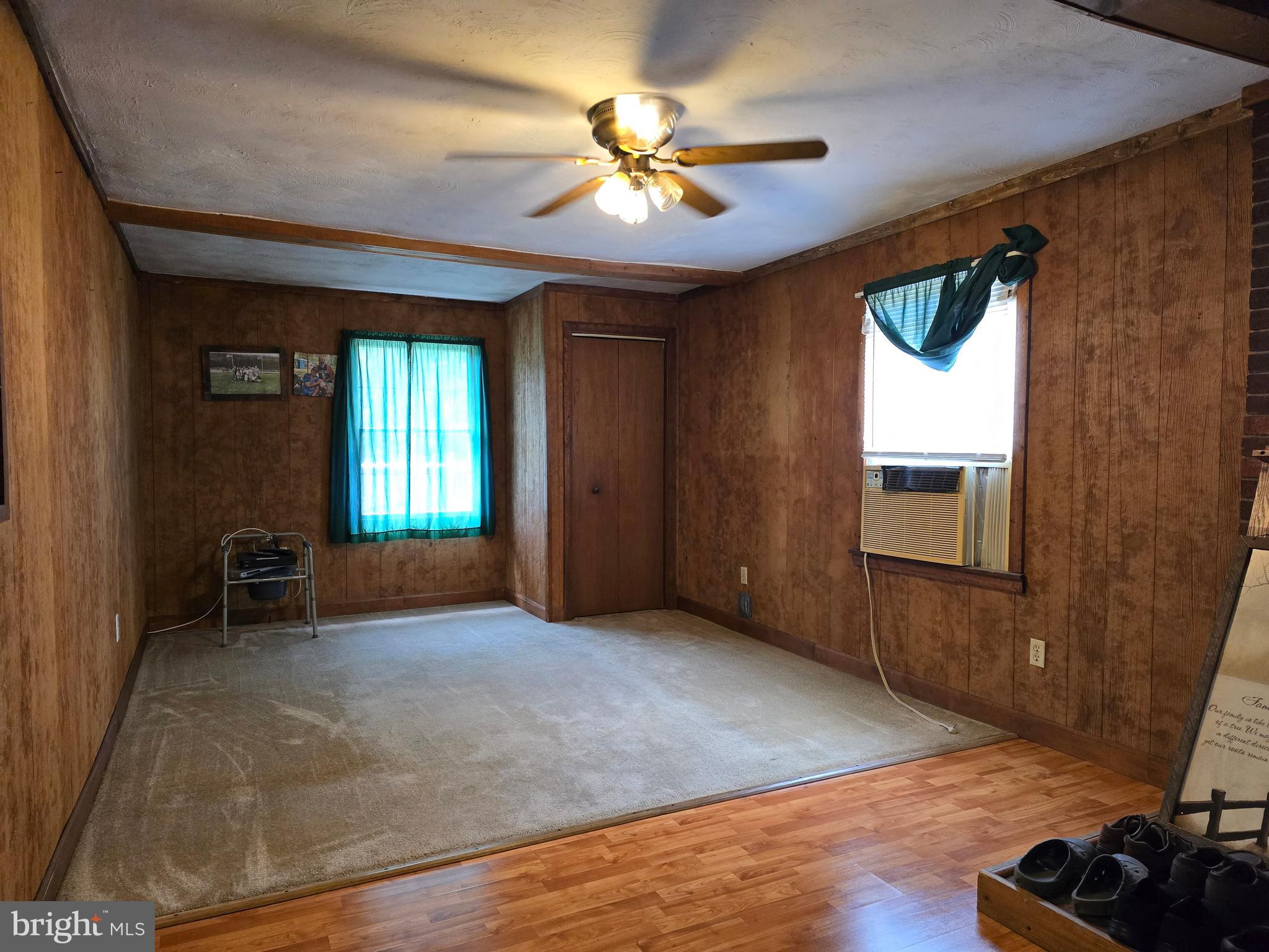 6231 Valley Road Berkeley Springs, WV 25411 - Photo 5 of 34 Family room with flu for woodstove