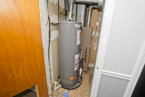 a bathroom with a granite countertop shower and a sink