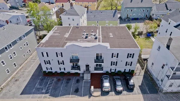 an aerial view of a house with wooden floor
