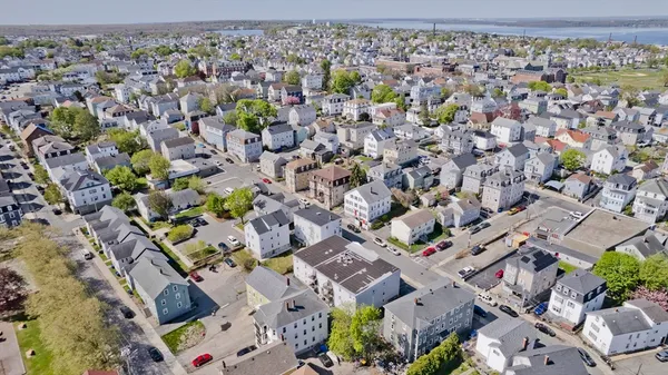an aerial view of a city with lots of residential buildings